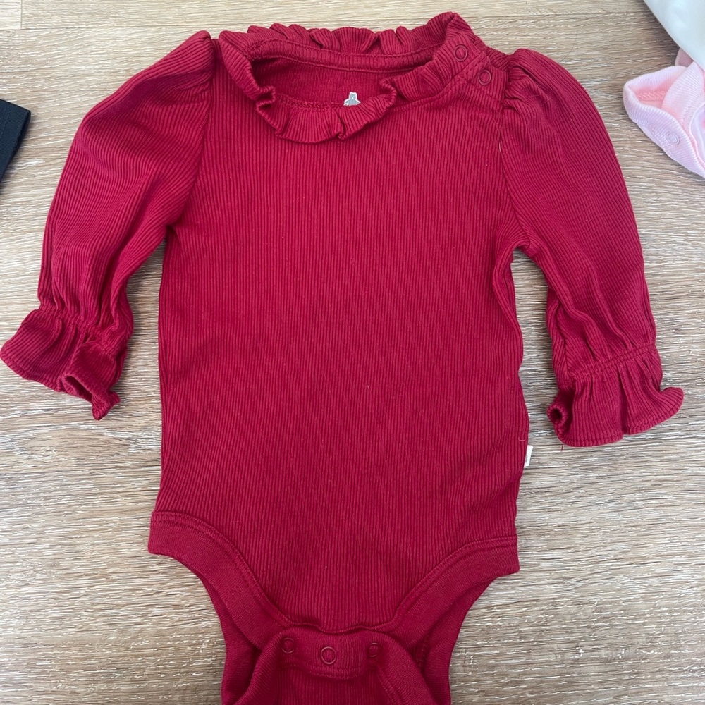 Red, navy blue, pink, and cream baby gap long sleeve onesies and gerber onesie